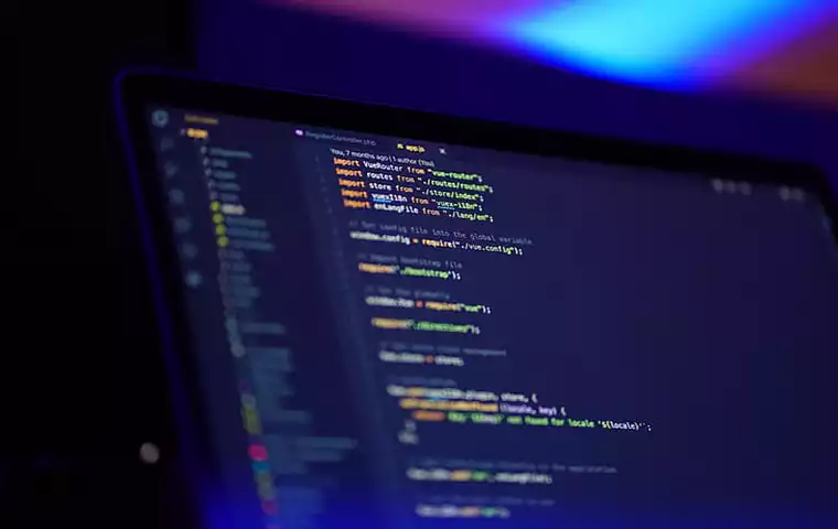 A desktop shows coding and android backend languages
