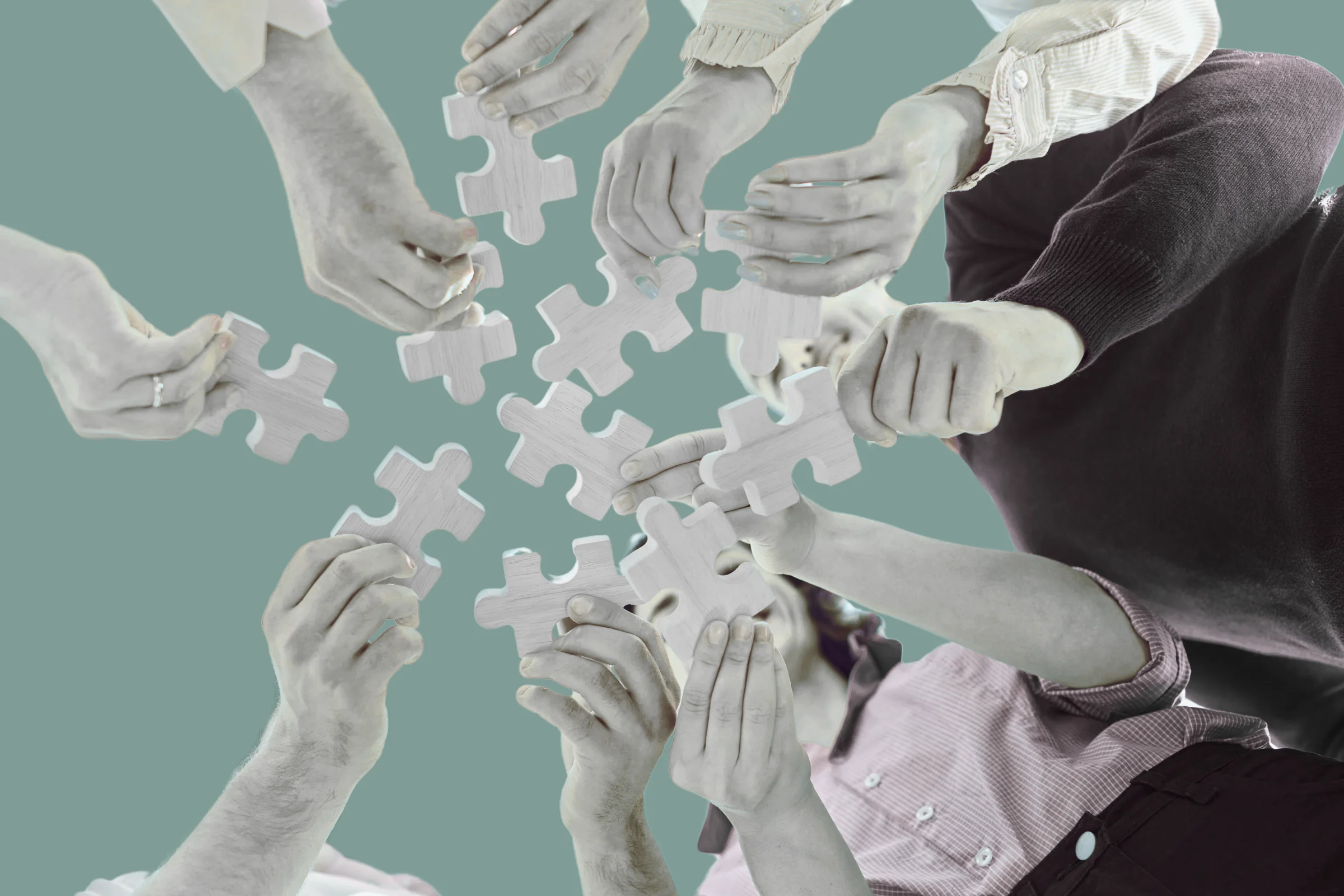 people completing a puzzle together